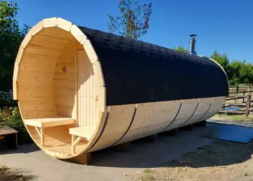 VIRU Grand 6.0m barrel sauna, full length with covered terrace benches and the changing-room door